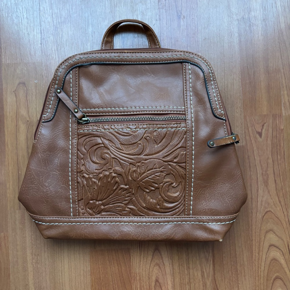 Women’s brown backpack with embossed design